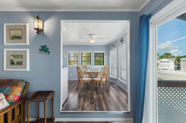 a dining room with furniture and wooden floor