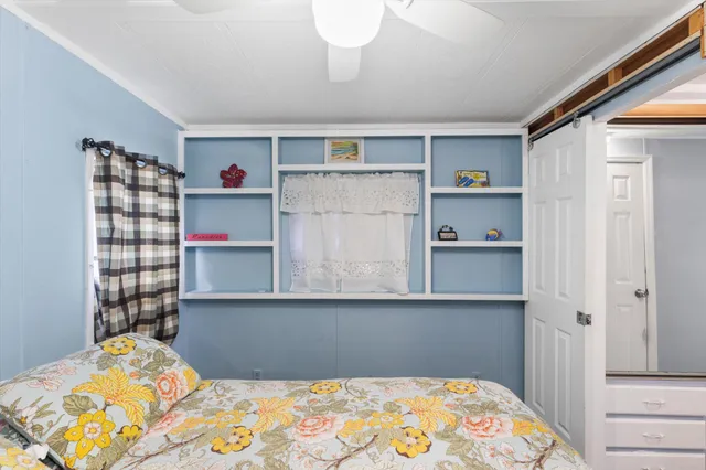 a bedroom with a bed and closet