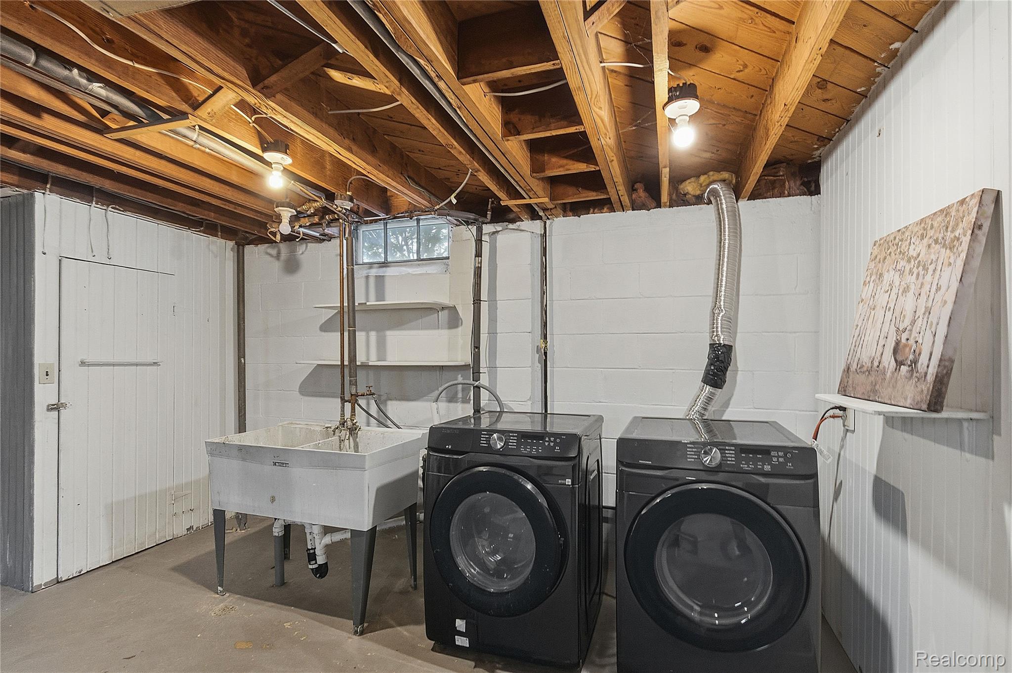 26104 Student Street Redford, MI 48239 - Photo 21 of 30 Washroom featuring unfinished concrete flooring and washer and dryer