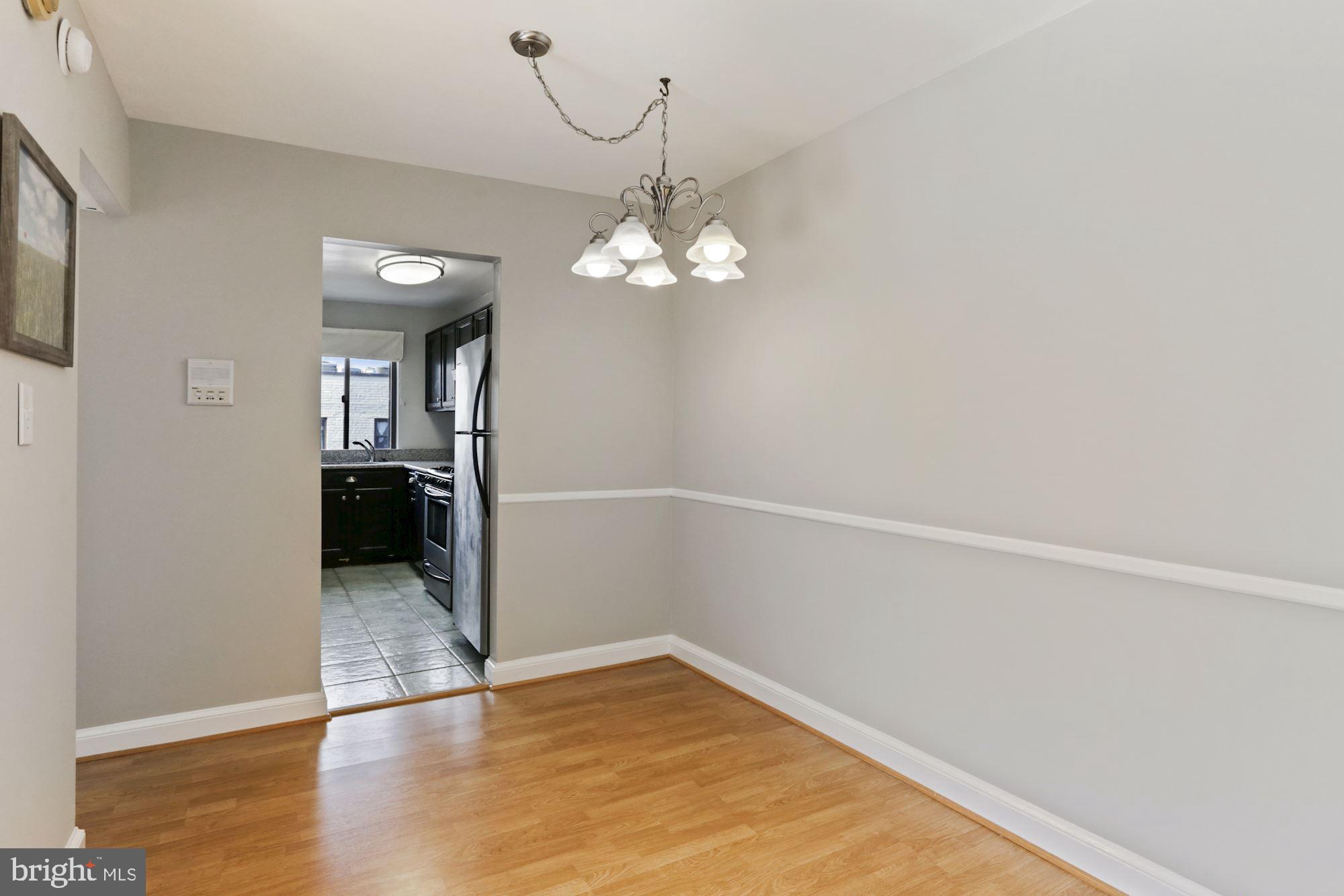 2604 Tunlaw Road Northwest, Unit 5 Washington, DC 20007 - Photo 7 of 28 DINING AREA WITH CHAIR RAIL