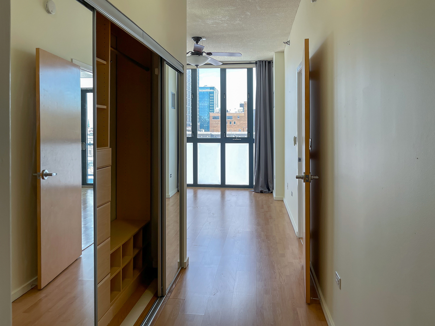 321 South Sangamon Street, Unit 604 Chicago, IL 60607 - Photo 11 of 24 a view of a hallway with wooden floor and staircase