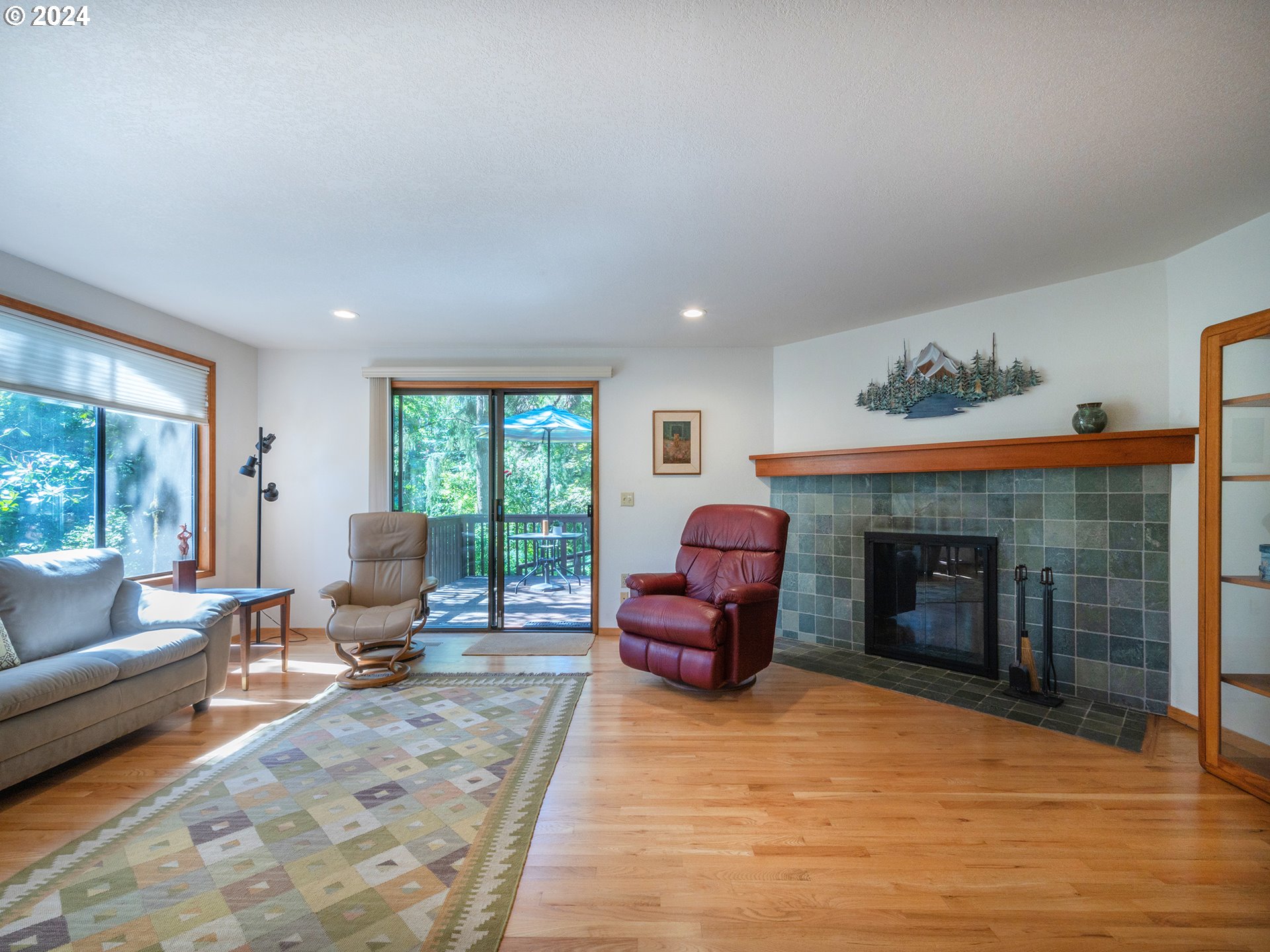 1778 West 27th Place Eugene, OR 97405 - Photo 11 of 43 a living room with furniture window and a fireplace