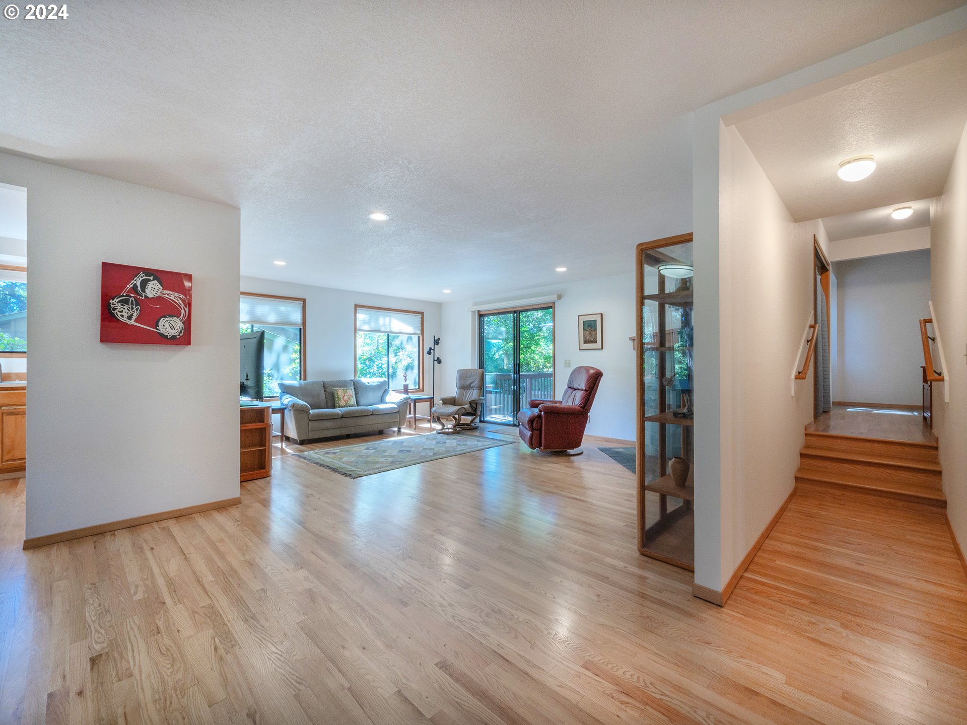 1778 West 27th Place Eugene, OR 97405 - Photo 15 of 43 a living room with furniture and a wooden floor