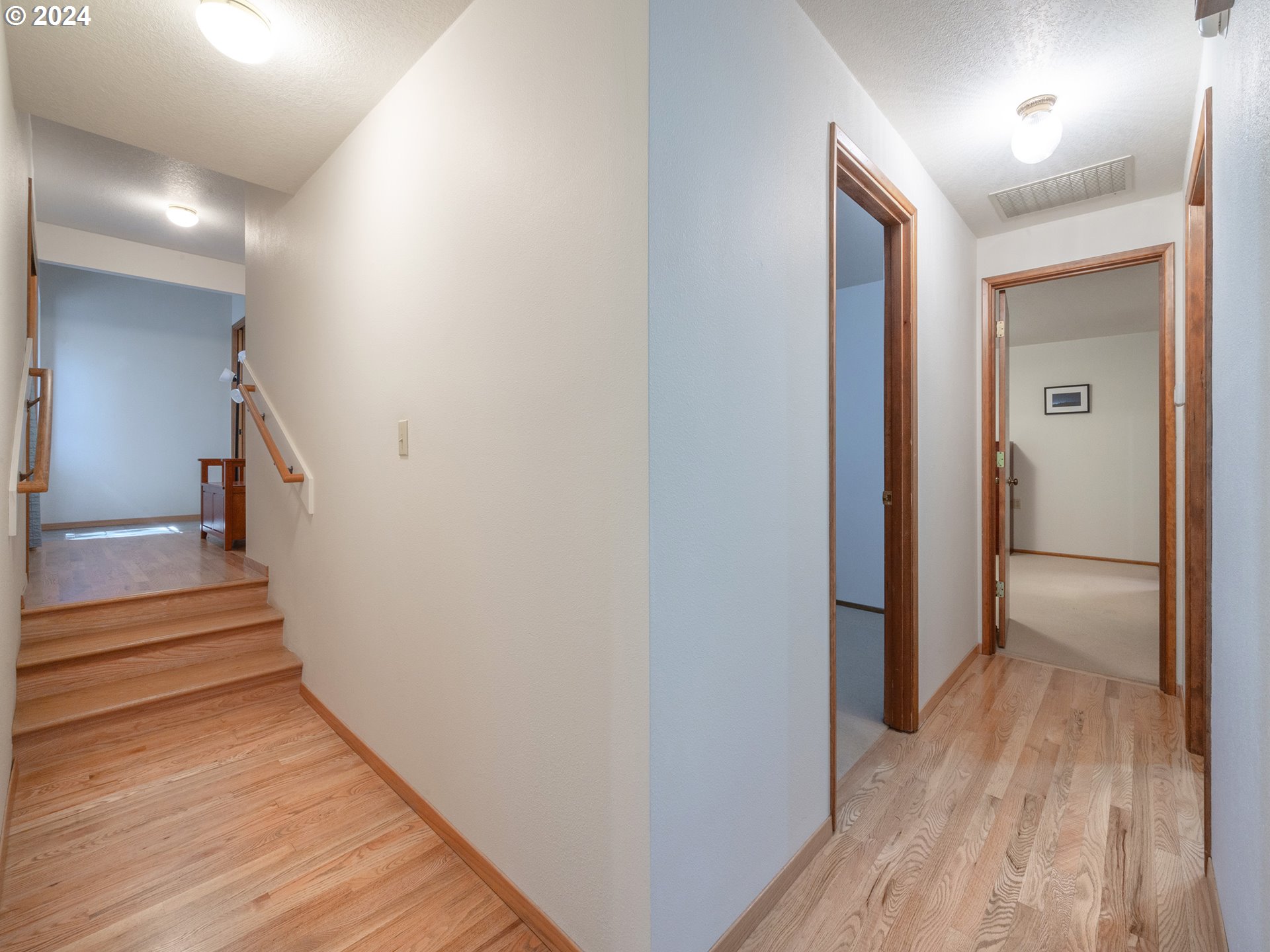 1778 West 27th Place Eugene, OR 97405 - Photo 24 of 43 a view of a hallway with wooden floor and staircase