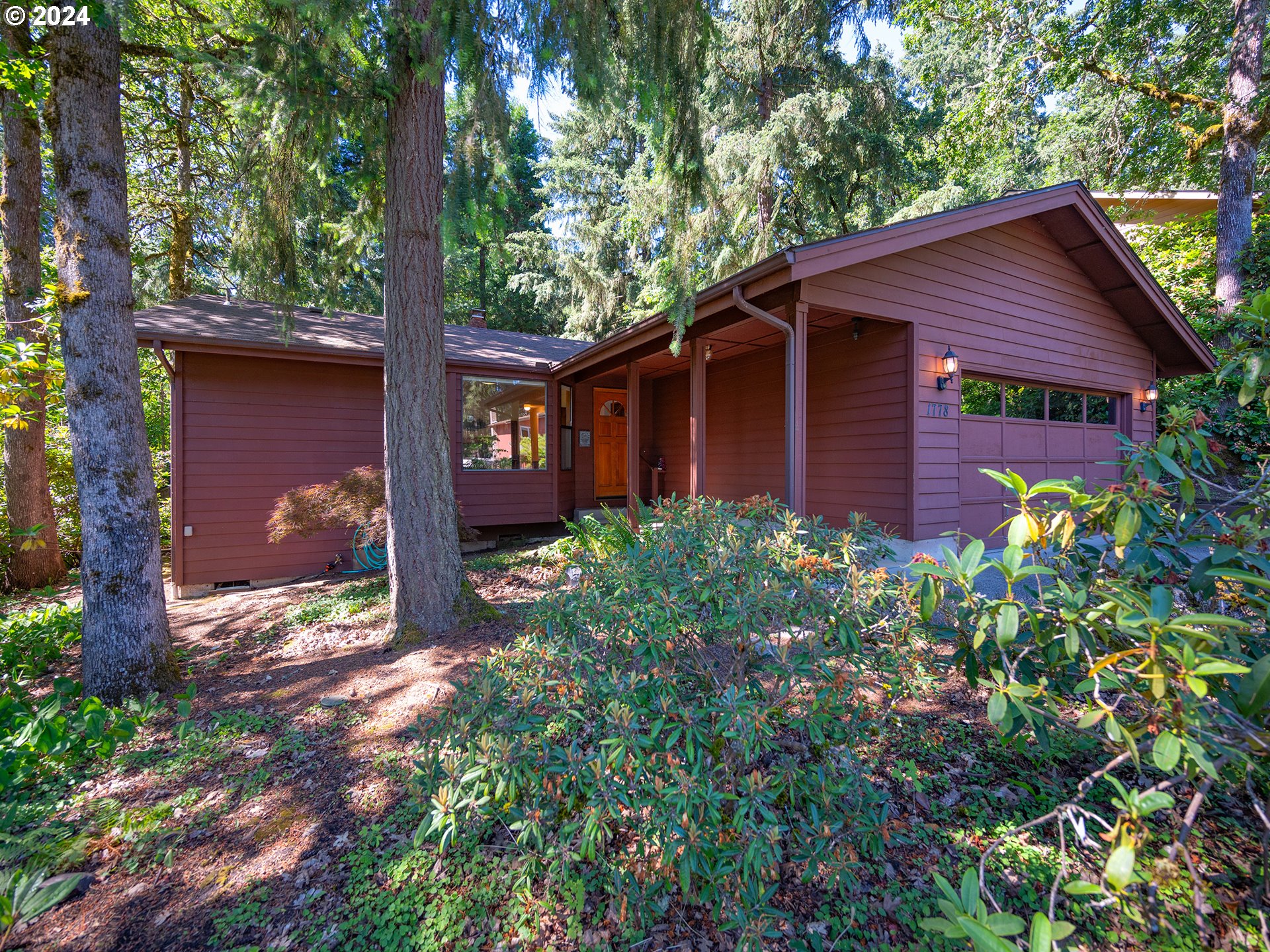 1778 West 27th Place Eugene, OR 97405 - Photo 3 of 43 a view of a house with a yard