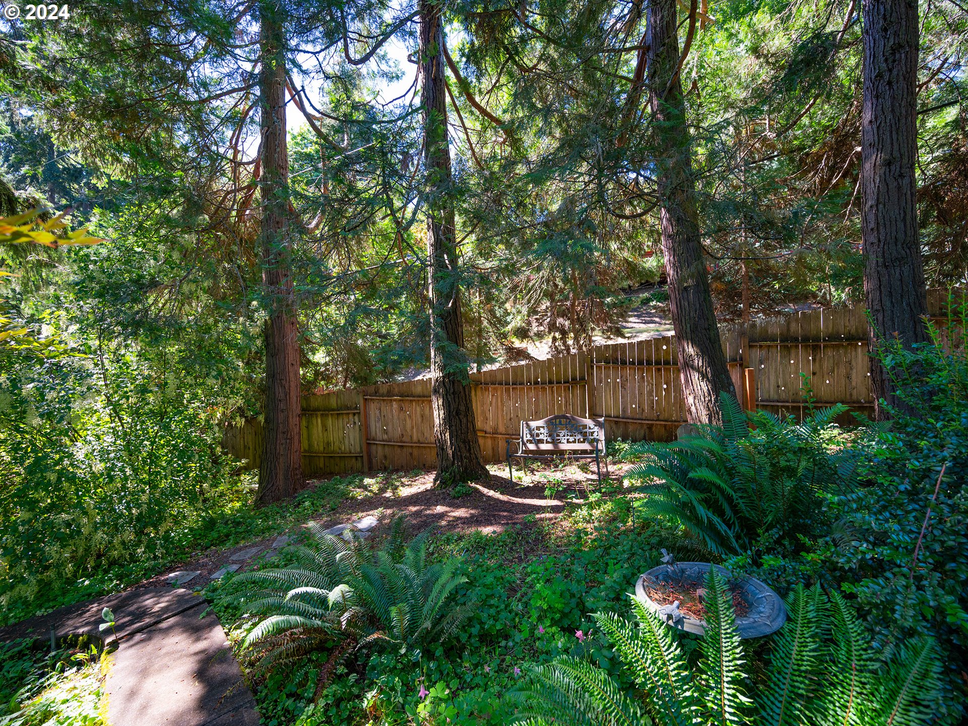 1778 West 27th Place Eugene, OR 97405 - Photo 37 of 43 a view of a backyard with plants and a patio