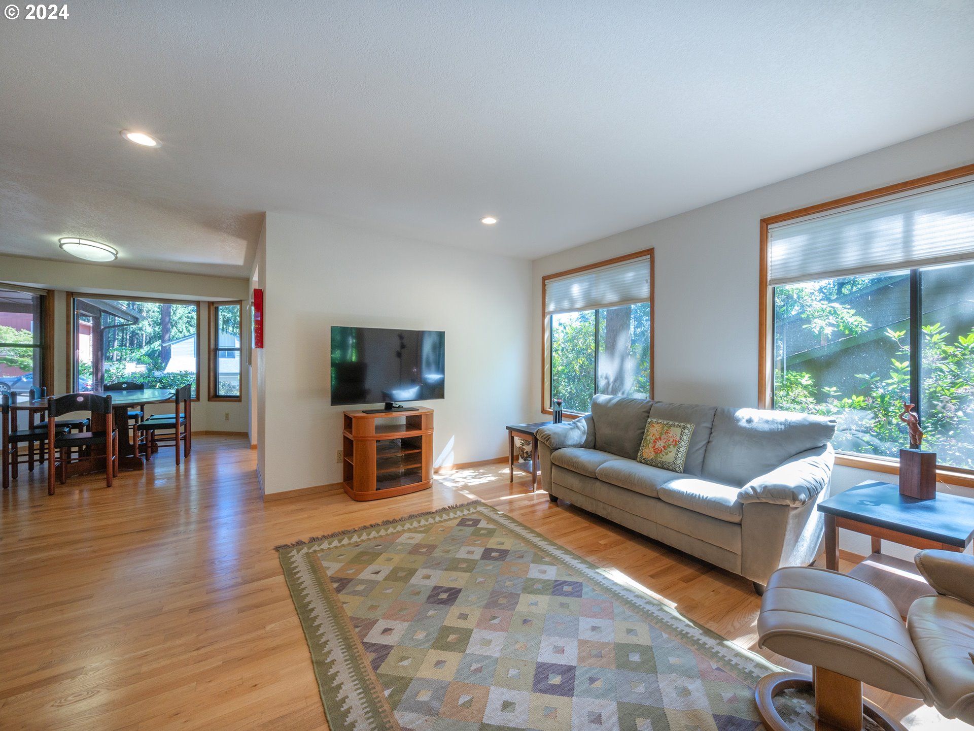 1778 West 27th Place Eugene, OR 97405 - Photo 9 of 43 a living room with furniture and a flat screen tv