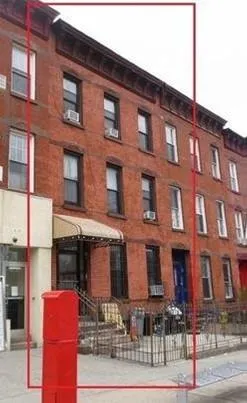 a front view of a building with street view