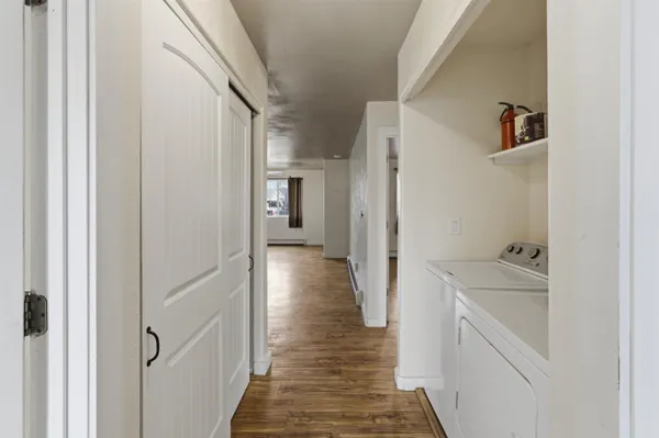 a view of a hallway with a wooden floors