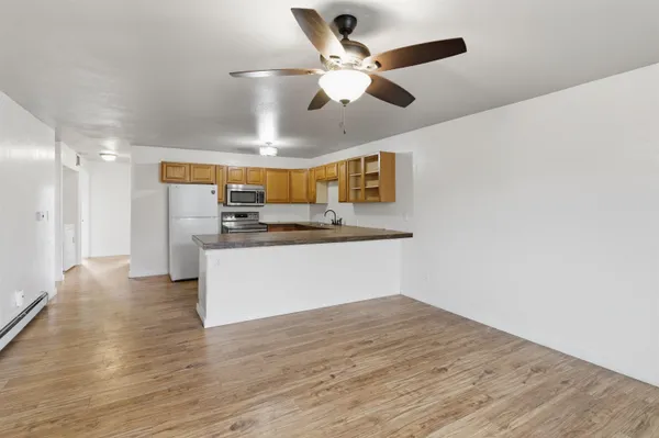 a view of kitchen with cabinets and wooden floor