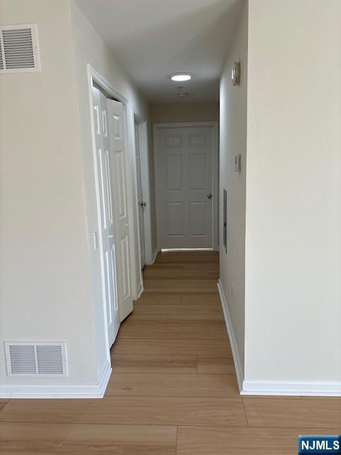 39 Union Street, Unit 301 Hackensack, NJ 07601 - Photo 12 of 14 a view of a hallway with wooden floor