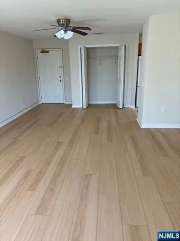a view of a hallway with paintings on the wall