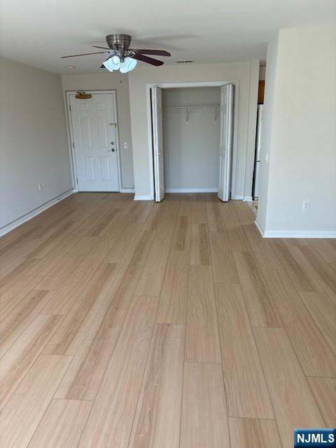 39 Union Street, Unit 301 Hackensack, NJ 07601 - Photo 13 of 14 a view of a room with wooden floor and chandelier fan
