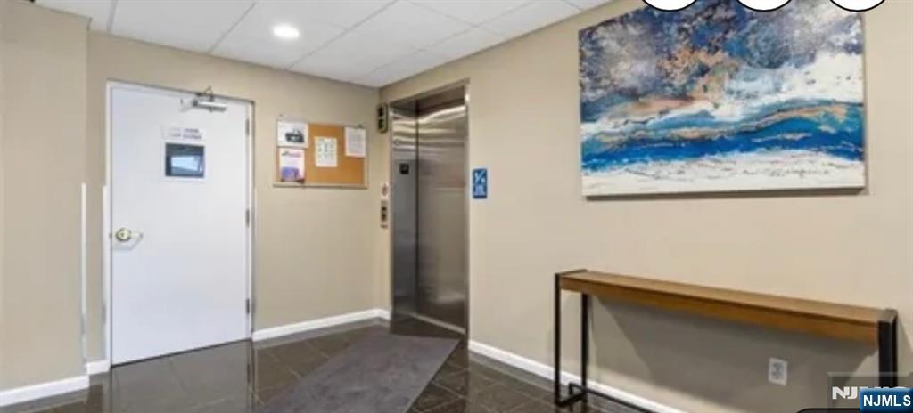 39 Union Street, Unit 301 Hackensack, NJ 07601 - Photo 14 of 14 a view of a hallway with paintings on the wall