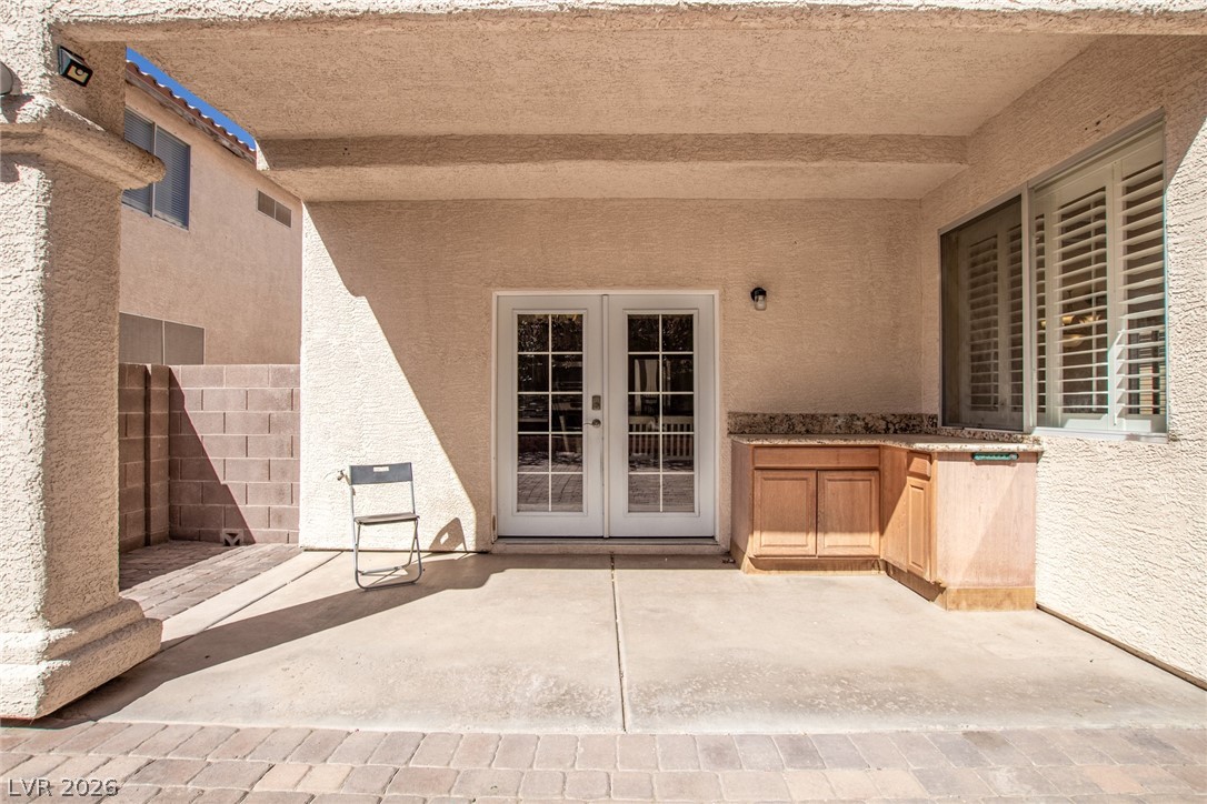 1477 Rancho Ridge Drive Henderson, NV 89012 - Photo 44 of 46 A covered patio retreat with a convenient outdoor kitchenette.