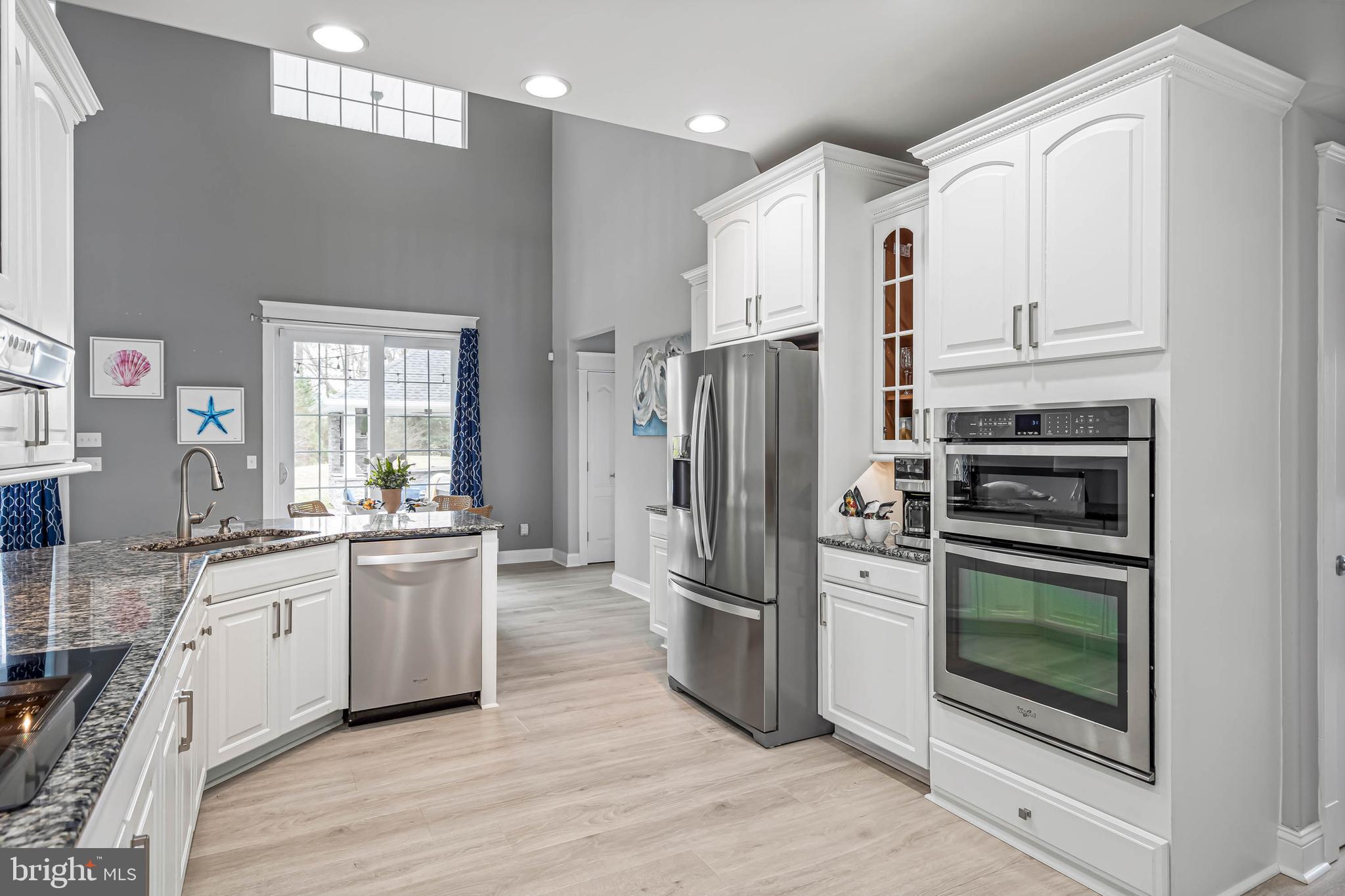 33096 Burbage Road Frankford, DE 19945 - Photo 14 of 53 a kitchen with stainless steel appliances a refrigerator sink and microwave