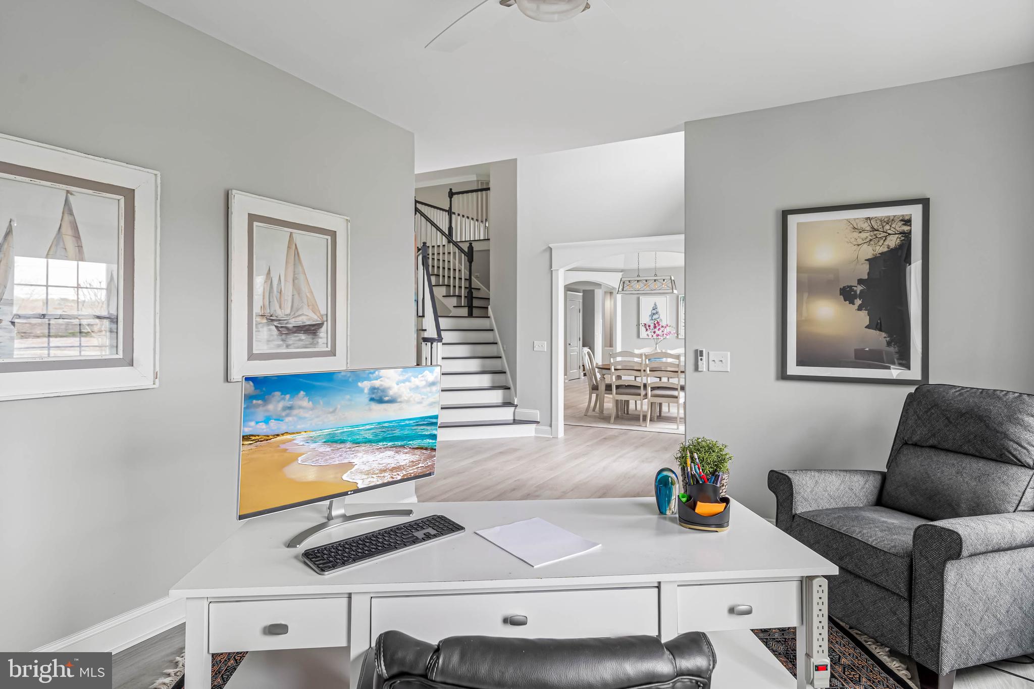 33096 Burbage Road Frankford, DE 19945 - Photo 20 of 53 a living room with furniture and painting on the wall