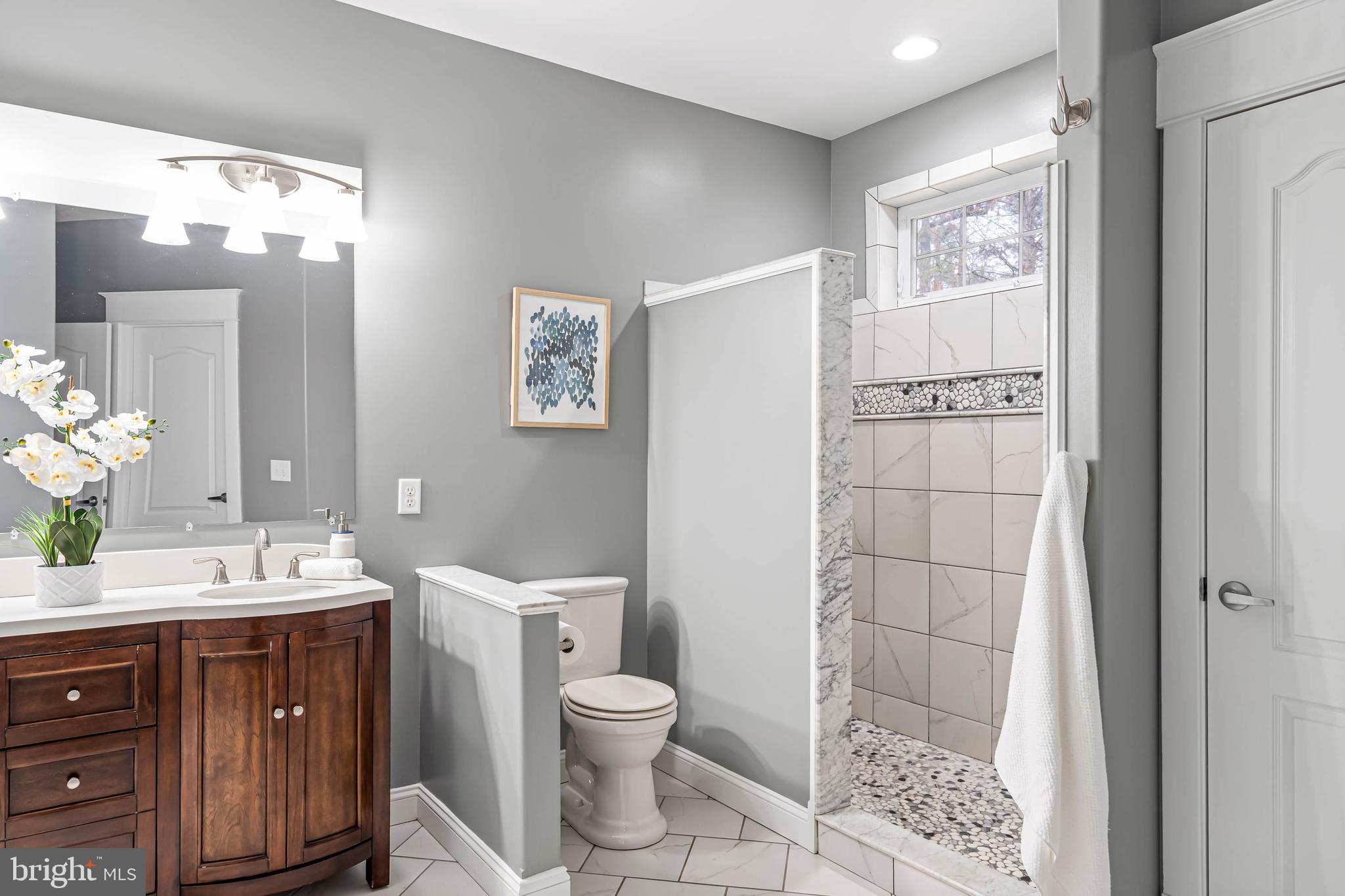 33096 Burbage Road Frankford, DE 19945 - Photo 28 of 53 a bathroom with a sink a toilet and shower
