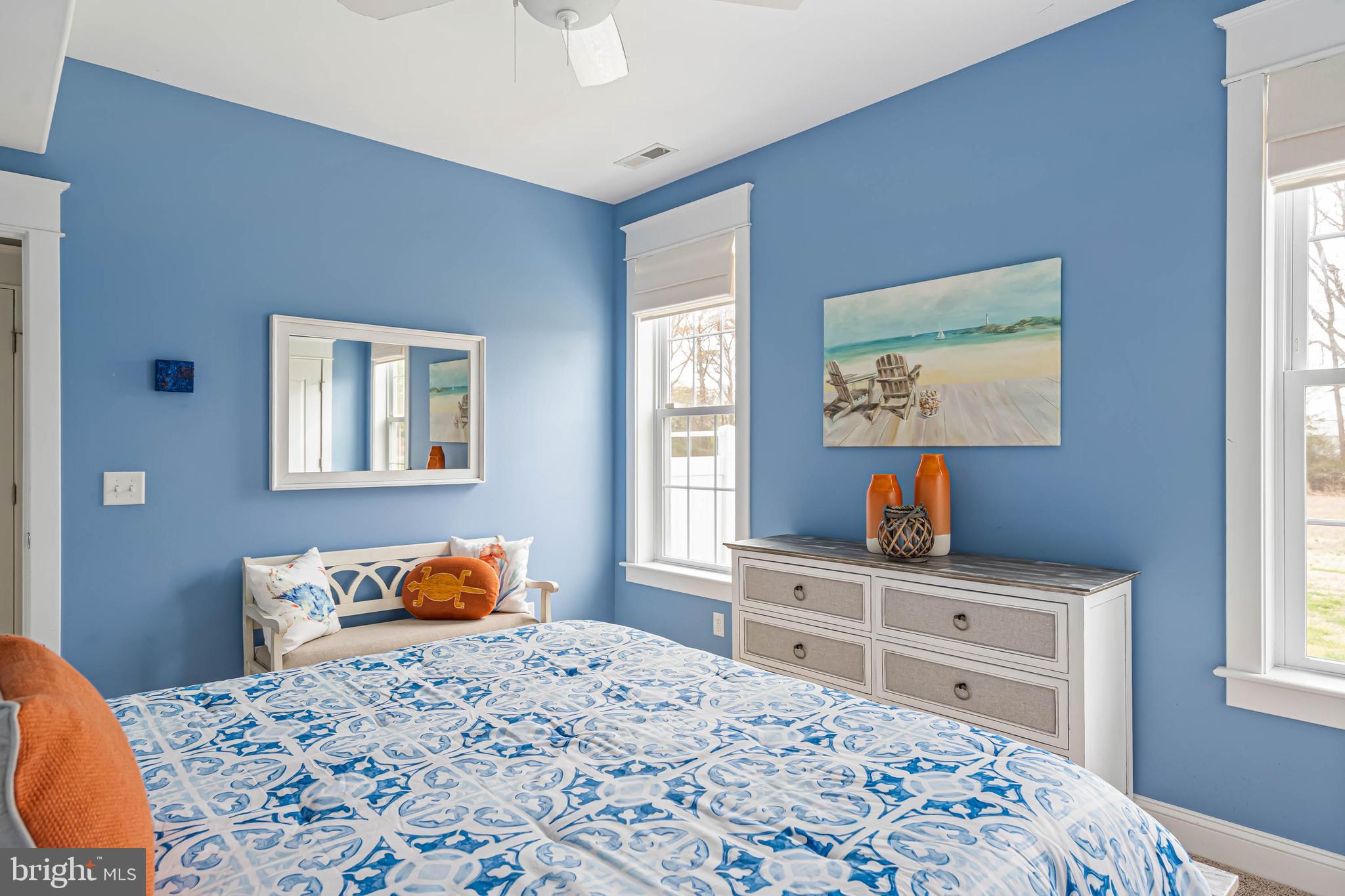 33096 Burbage Road Frankford, DE 19945 - Photo 31 of 53 a bedroom with a bed and dresser with mirror