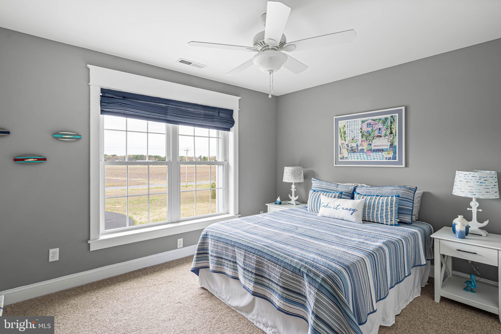 33096 Burbage Road Frankford, DE 19945 - Photo 33 of 53 a bedroom with a large bed and a window