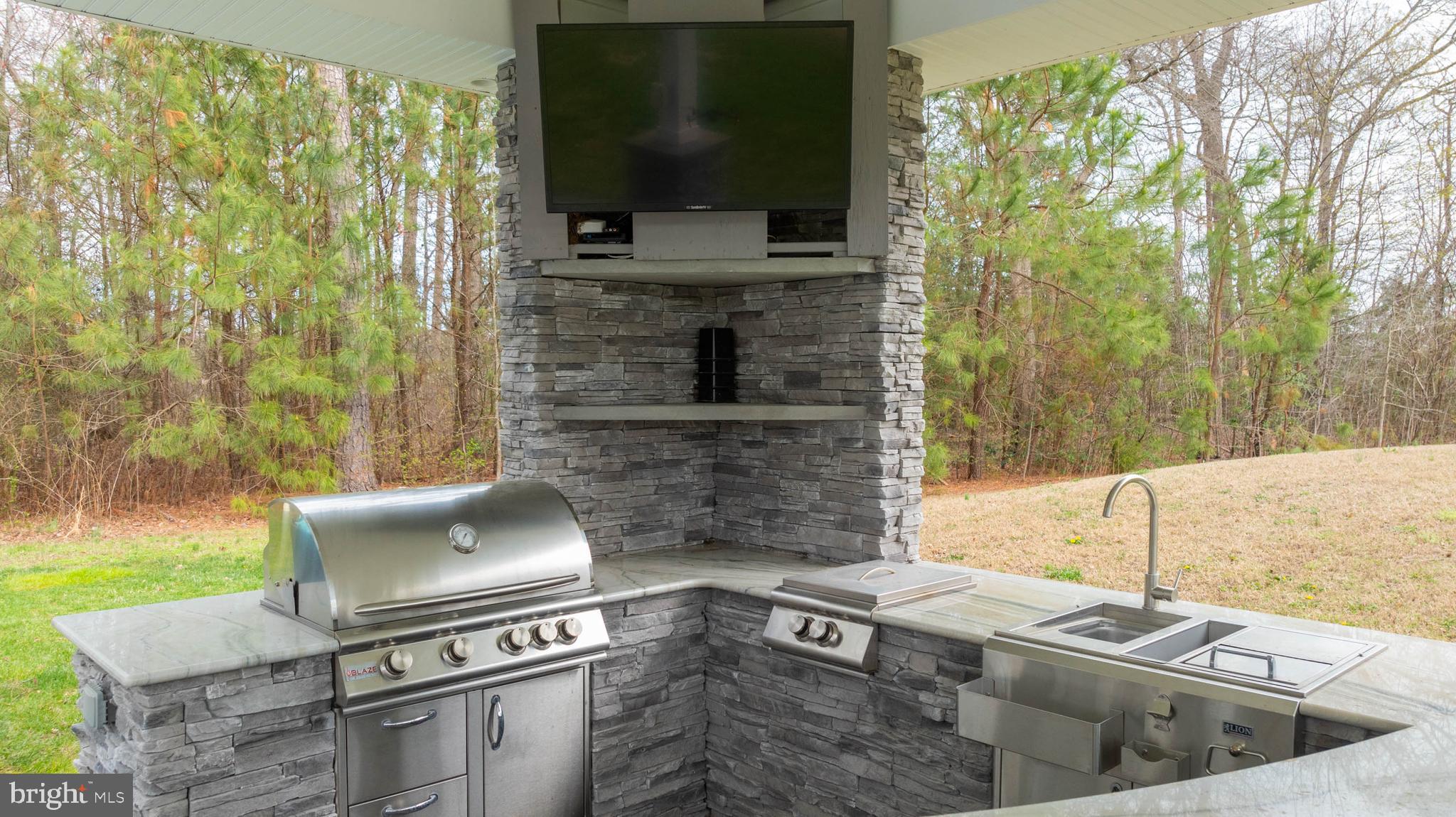 33096 Burbage Road Frankford, DE 19945 - Photo 46 of 53 a living room with furniture and a flat screen tv