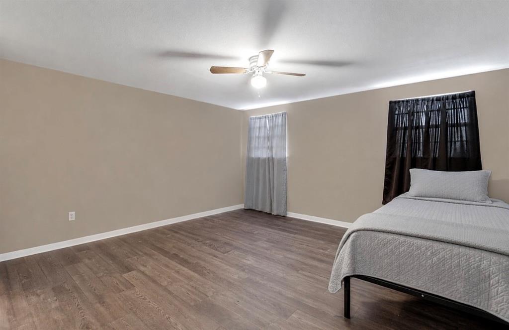 3952 J J Rendon Road Burleson, TX 76028 - Photo 15 of 25 Second bedroom upstairs with a walk in closet and private bathroom.