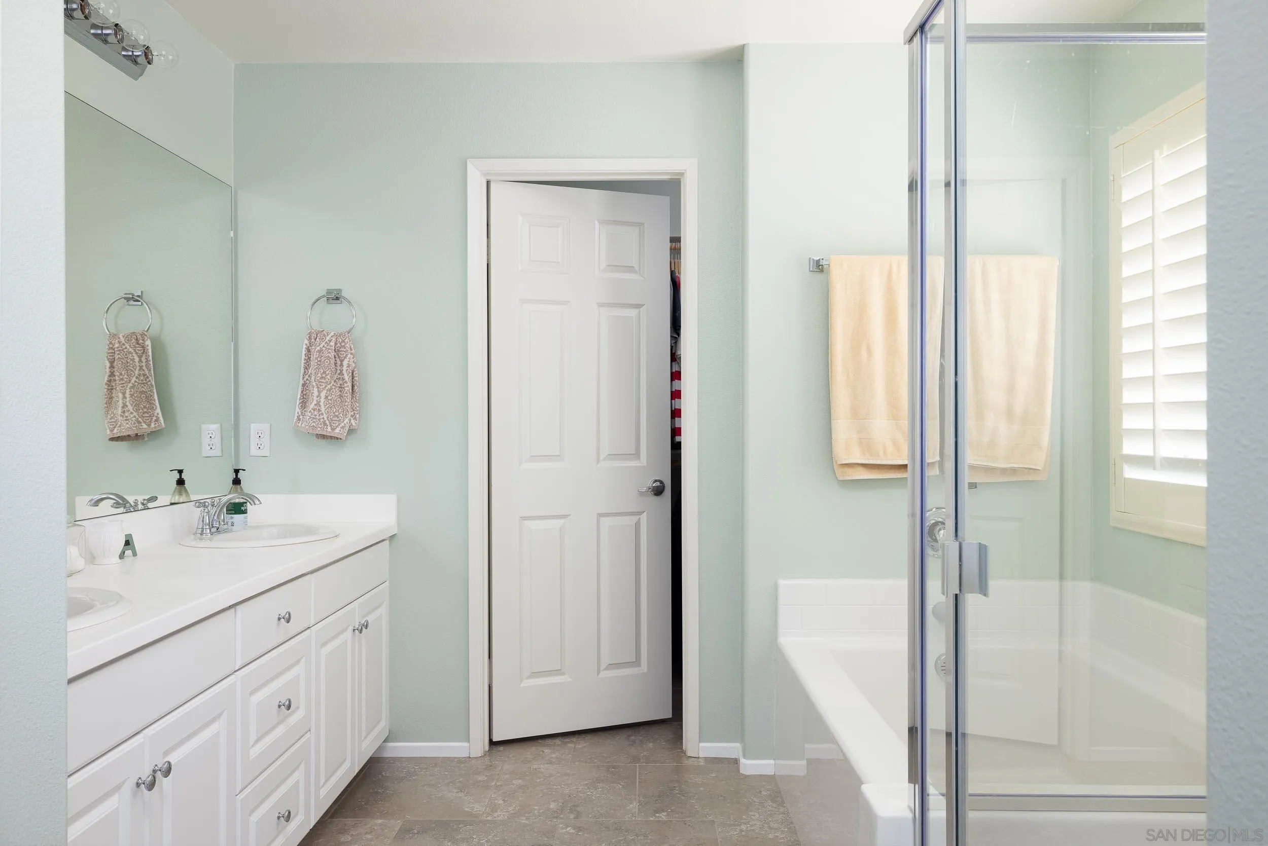 211 Spotted Saddle Way Fallbrook, CA 92028 - Photo 11 of 24 a en suite bathroom with a double vanity sink mirror and