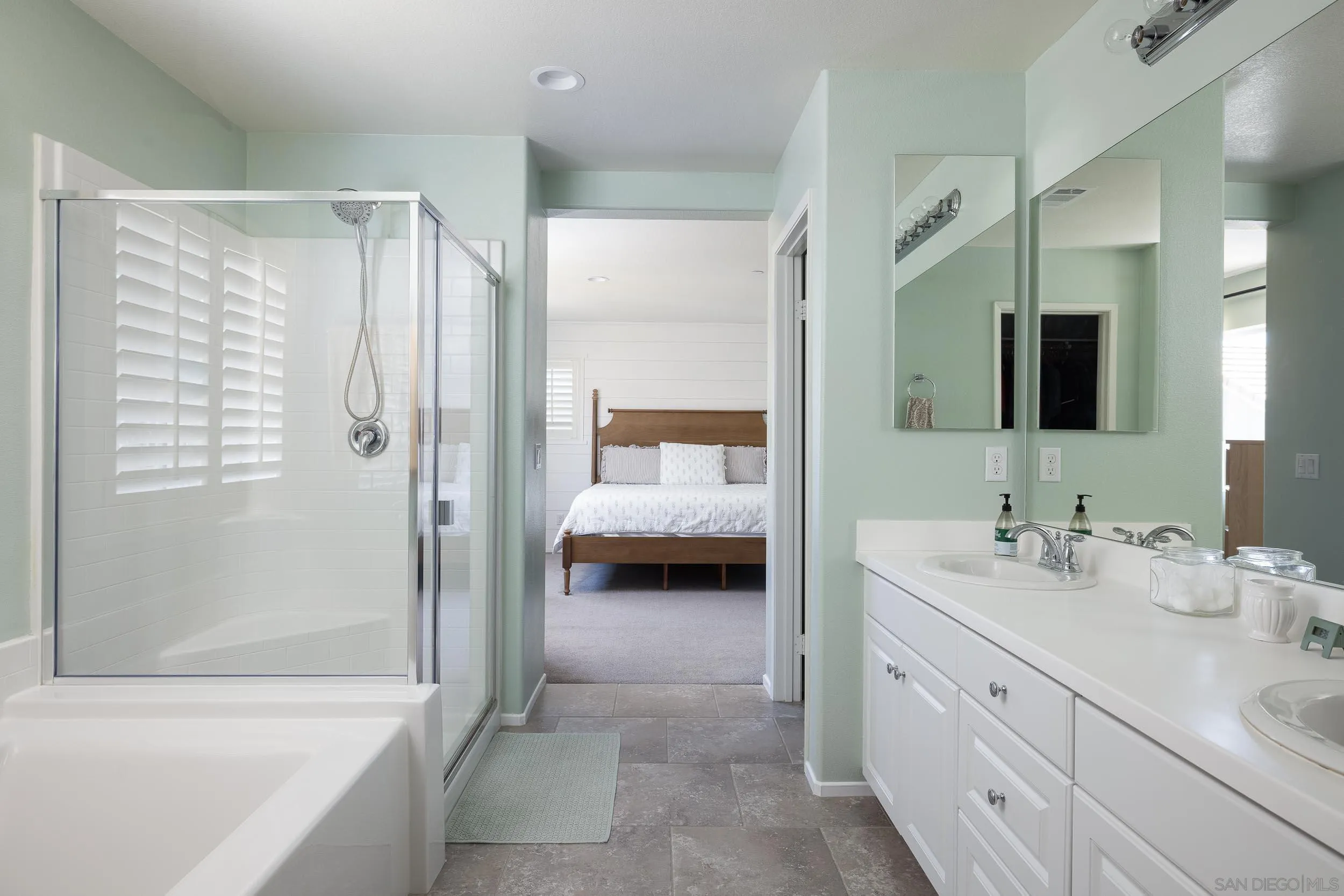 211 Spotted Saddle Way Fallbrook, CA 92028 - Photo 12 of 24 a en suite spacious bathroom with a double vanity sink and mirror