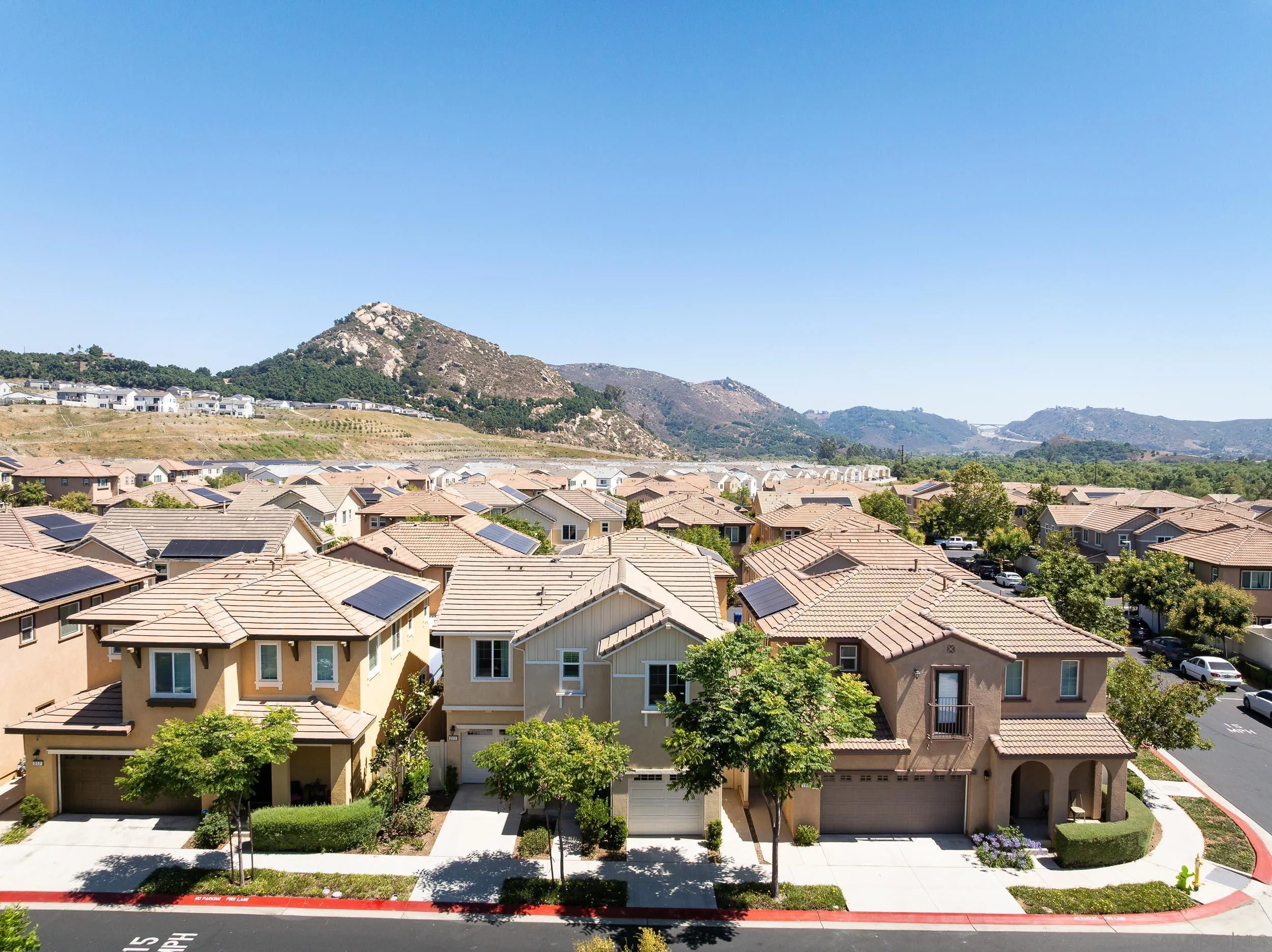 211 Spotted Saddle Way Fallbrook, CA 92028 - Photo 2 of 24 a front view of residential houses and street view