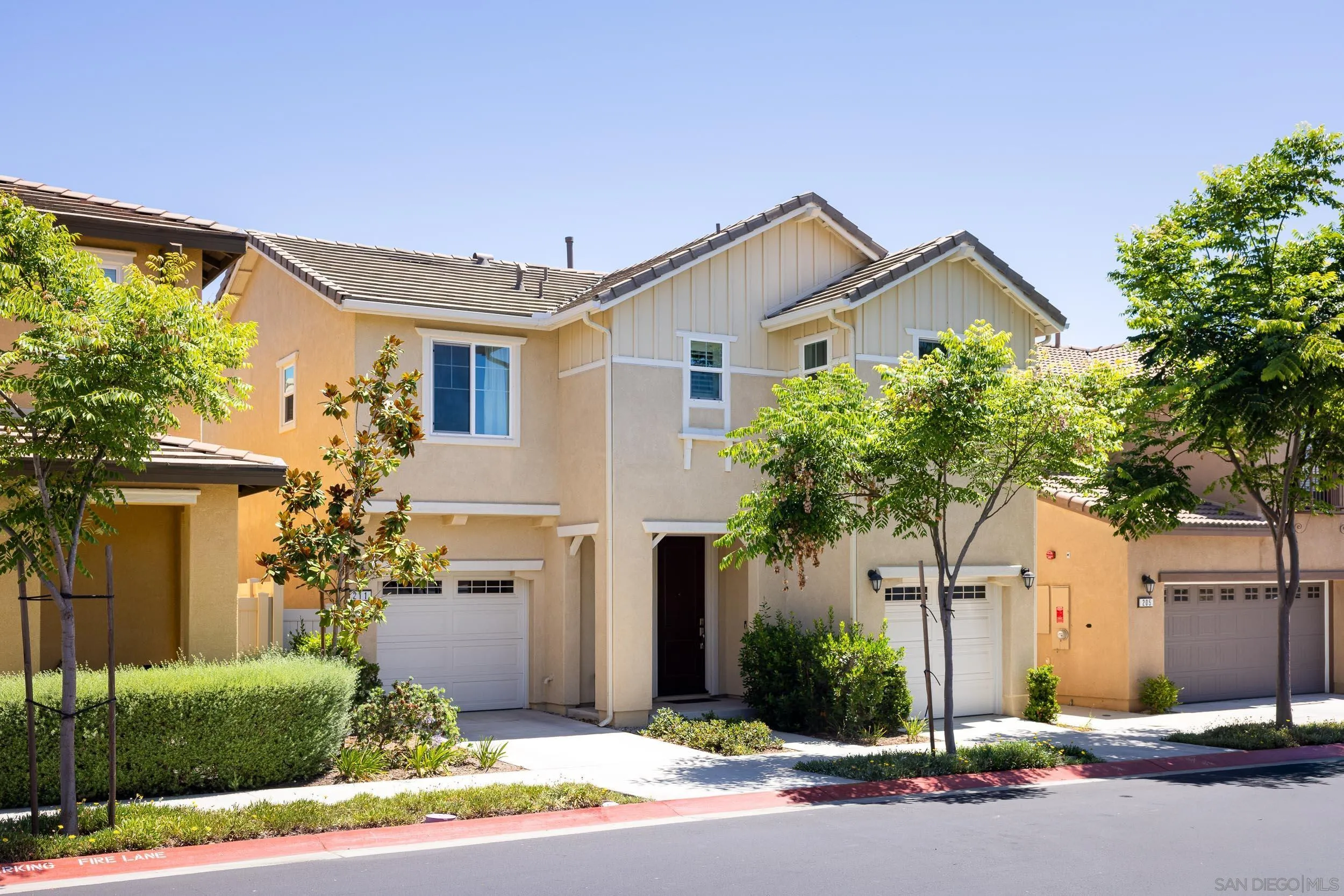 211 Spotted Saddle Way Fallbrook, CA 92028 - Photo 21 of 24 a front view of house with garage and yard