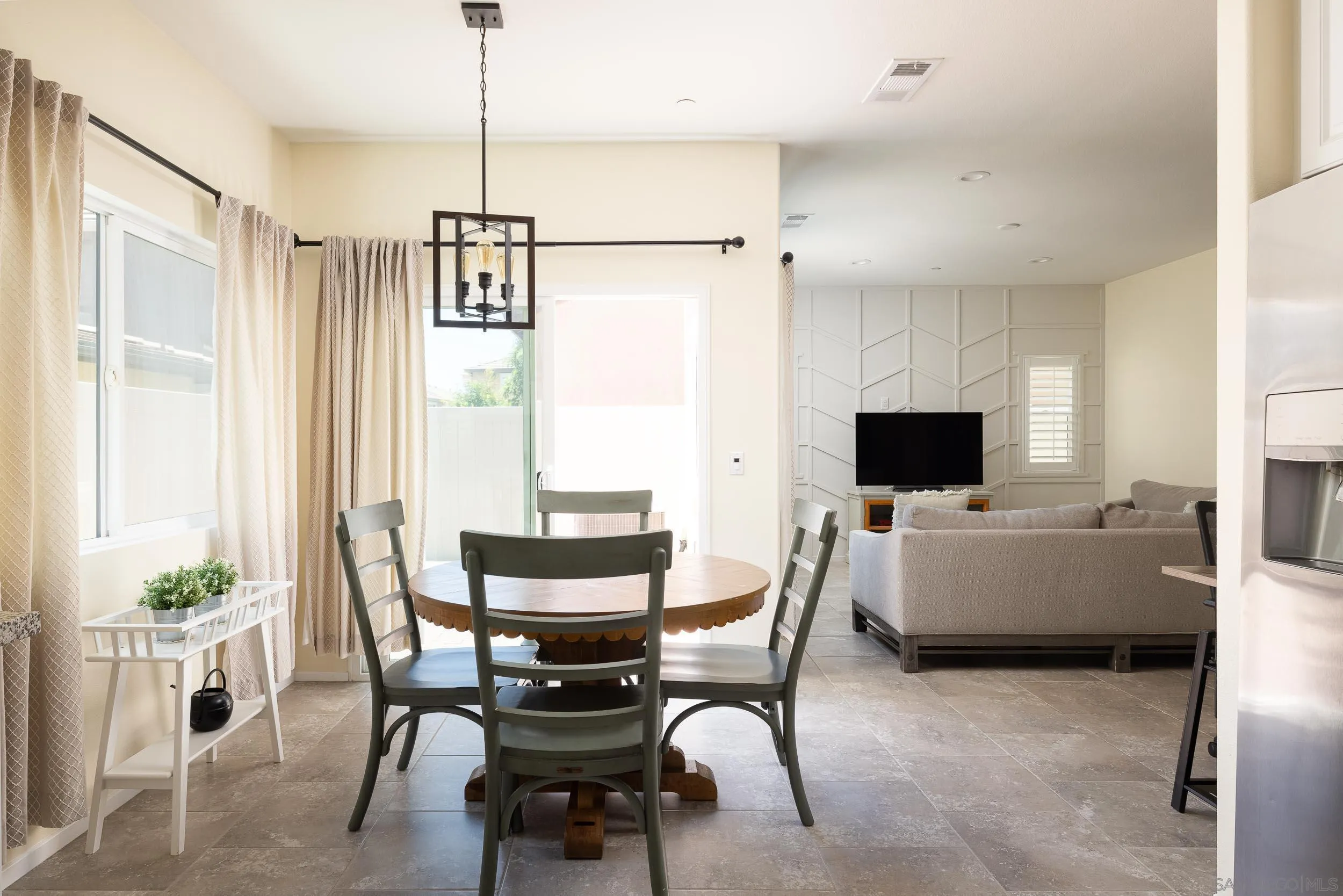 211 Spotted Saddle Way Fallbrook, CA 92028 - Photo 8 of 24 a view of a livingroom with furniture and a flat screen tv