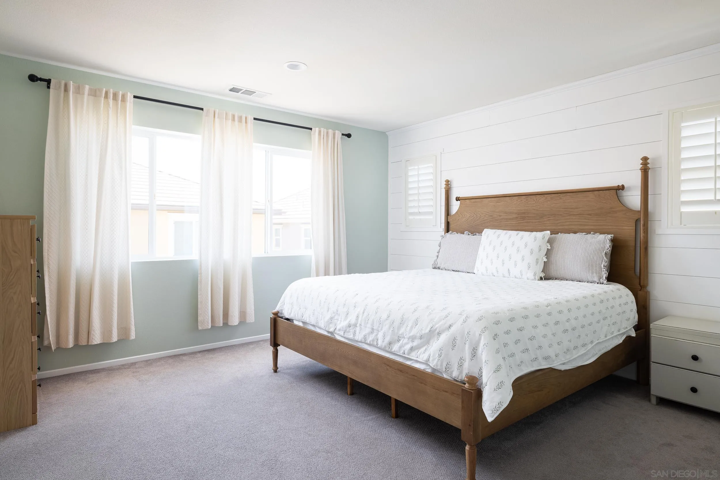 211 Spotted Saddle Way Fallbrook, CA 92028 - Photo 9 of 24 a bed sitting in a bedroom next to a window