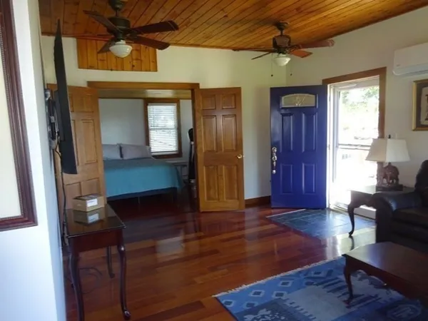 a room with a bed and a window