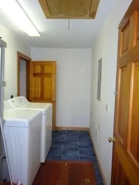 a bedroom with a bed and a table in it