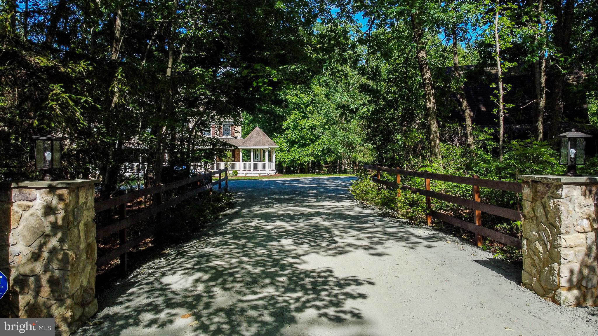 813 Blacks Hill Road Great Falls, VA 22066 - Photo 2 of 92 Welcome to this Private 3-Acre Estate
