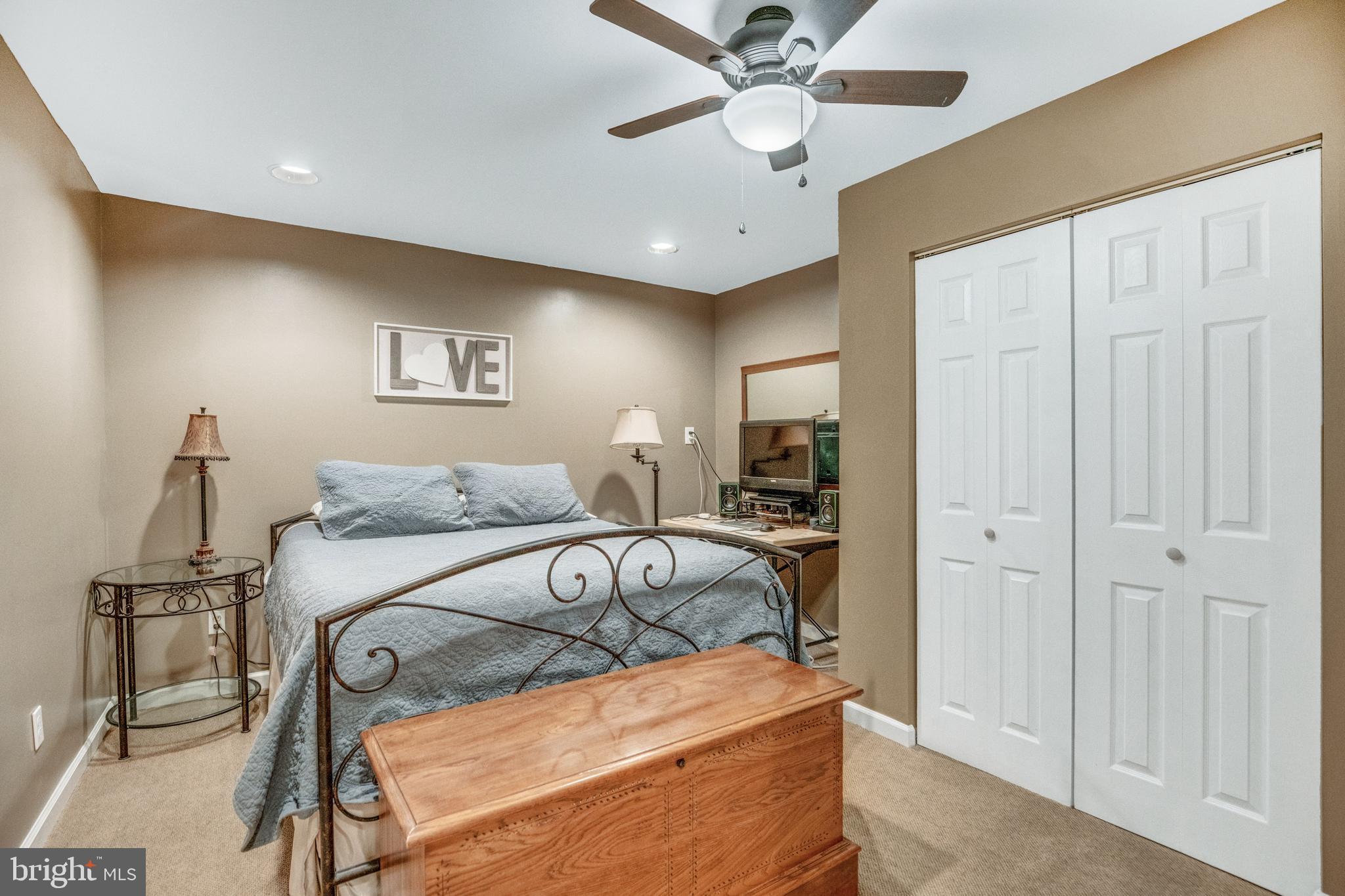 920 Carson Road Huntingtown, MD 20639 - Photo 23 of 32 a bedroom with a bed and a chandelier