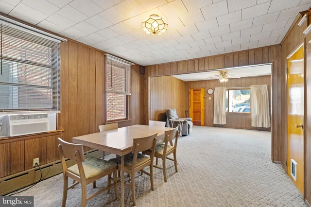 a view of a dining room with furniture and window