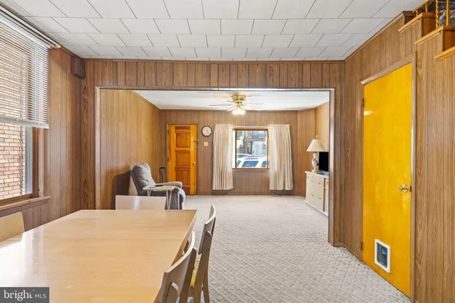 a view of a livingroom with furniture and windows