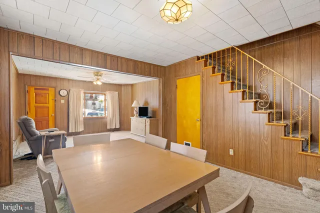 a view of a livingroom with furniture window and wooden floor