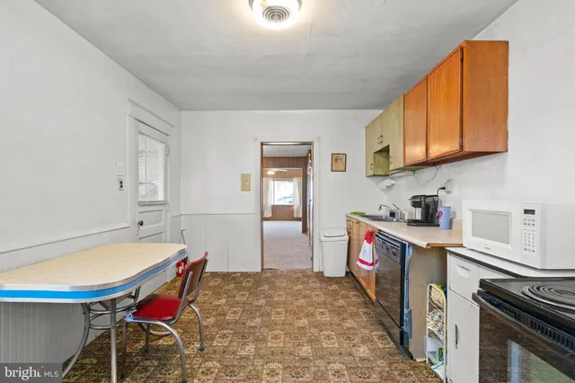 a kitchen with a stove and a refrigerator