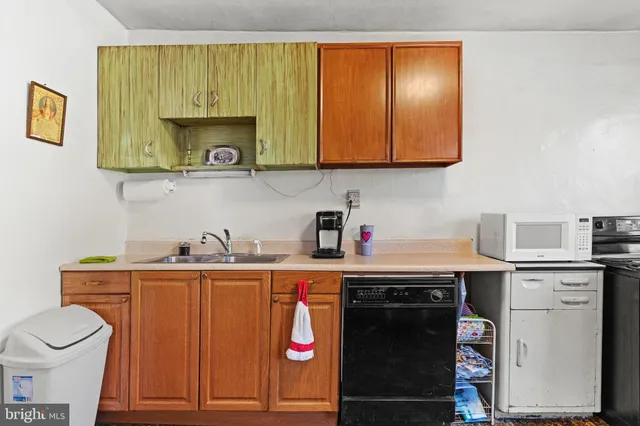 a kitchen with stainless steel appliances granite countertop a sink and cabinets