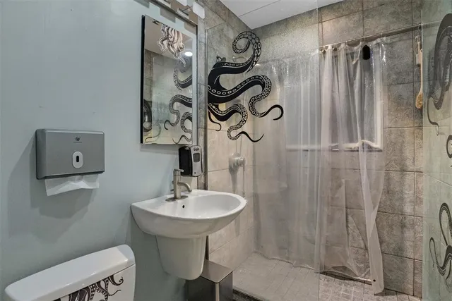 a bathroom with a sink and mirror