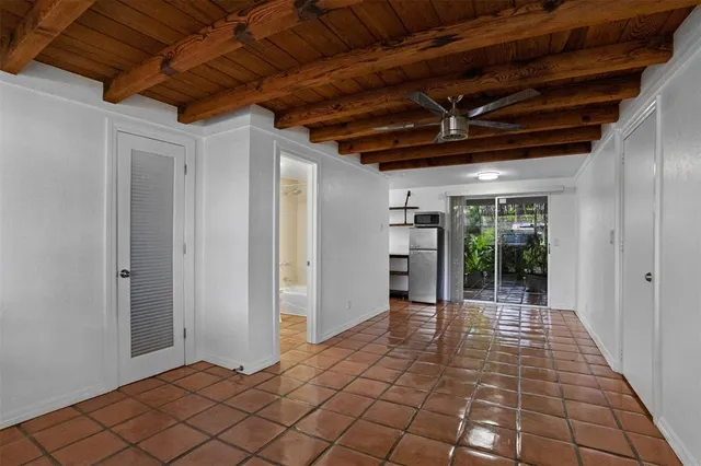 a view of hallway with wooden floor