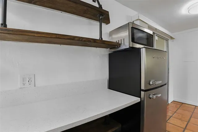 a view of a refrigerator in kitchen