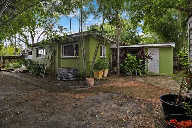 a view of a house with a yard and plants