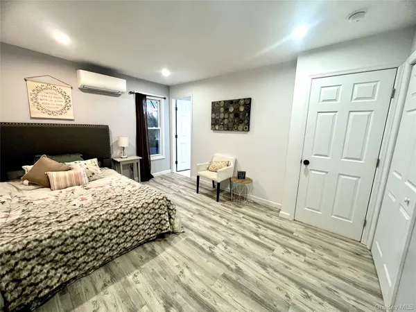 a bedroom with a bed and a table
