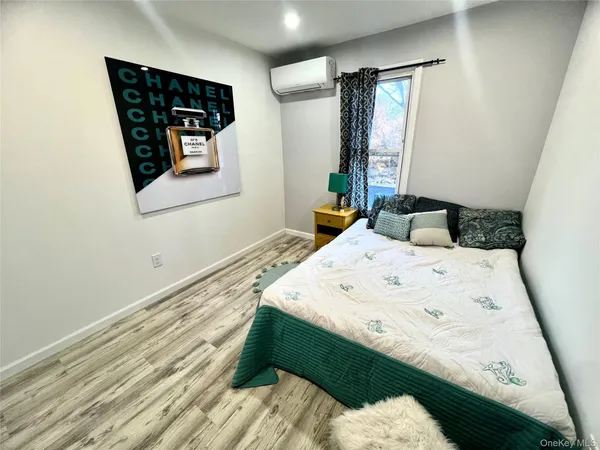 a bedroom with a bed and window