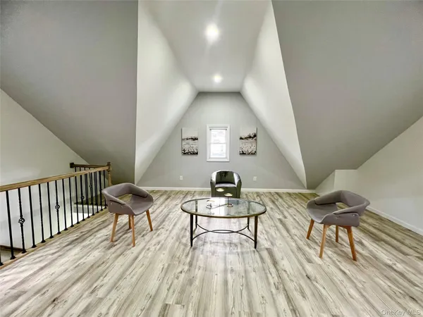 a view of a livingroom with furniture and wooden floor