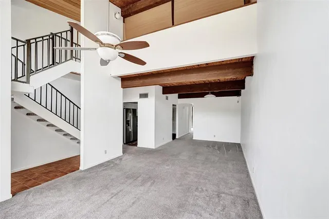 a view of a hallway with staircase
