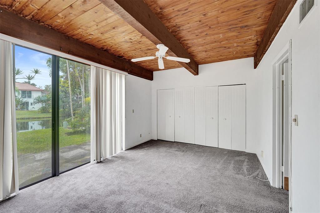 750 East Coco Plum Circle, Unit 2 Plantation, FL 33324 - Photo 9 of 21 a view of an empty room with windows